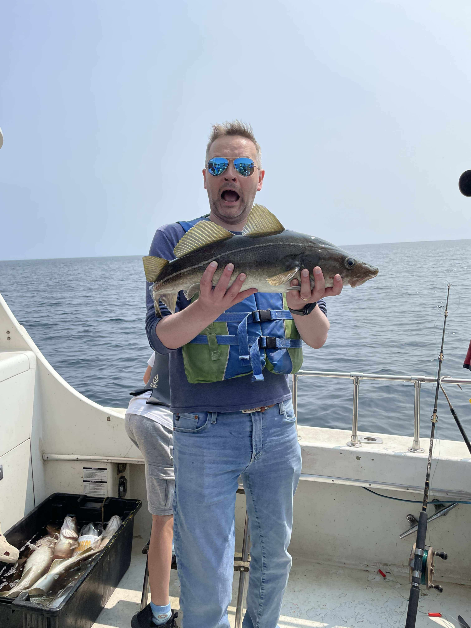 Tim proudly holding a fish